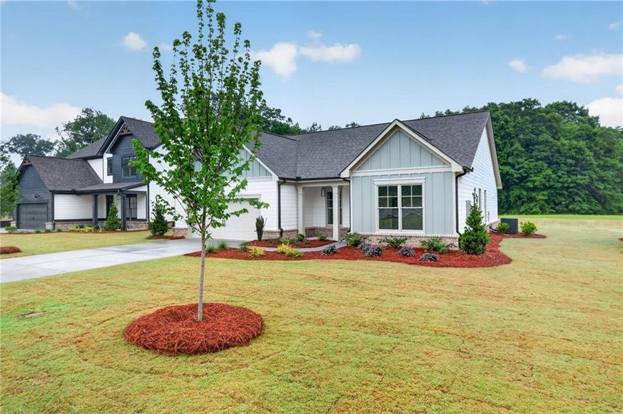 Front exterior of a new home in , Winder, GA, highlighting curb appeal (Image 2). Front exterior of a new home in , Winder, GA, highlighting curb appeal (Image 2).