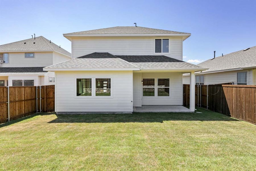 Exterior details and patio area of a home in Keeneland, Aubrey (Image 3).