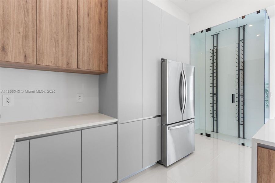 A DEDICATED WINE CLOSET with 55-bottle DISPLAY RACK adds a LUXURIOUS TOUCH to your ENTERTAINING SPACE!