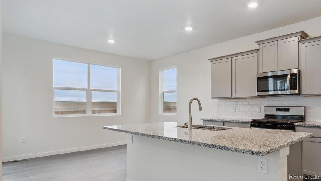 Furnished interior view inside a new home in Silver Peaks, Lochbuie (Image 4).