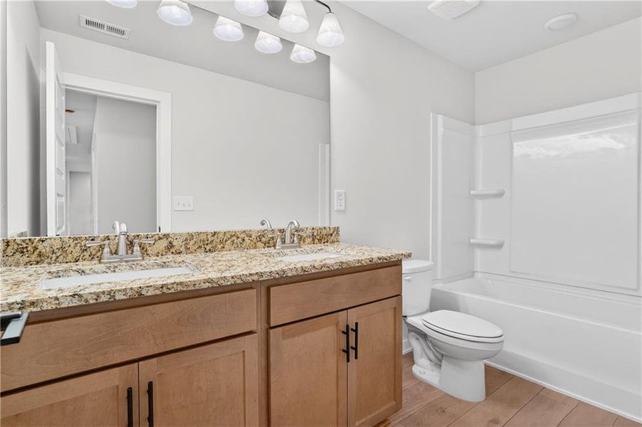 Furnished interior view inside a new home in The Fairways at Mirror Lake, Villa Rica (Image 12).
