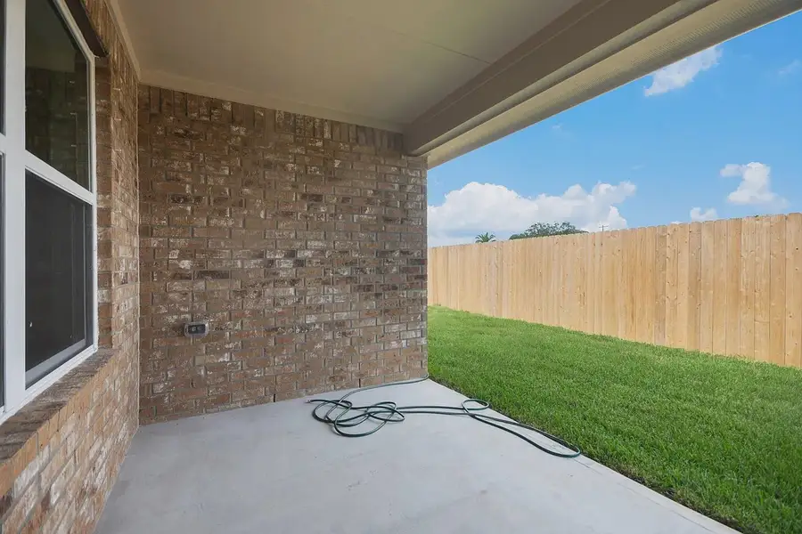 Exterior details and patio area of a home in Kiber Reserve, Angleton (Image 11). Exterior details and patio area of a home in Kiber Reserve, Angleton (Image 11).