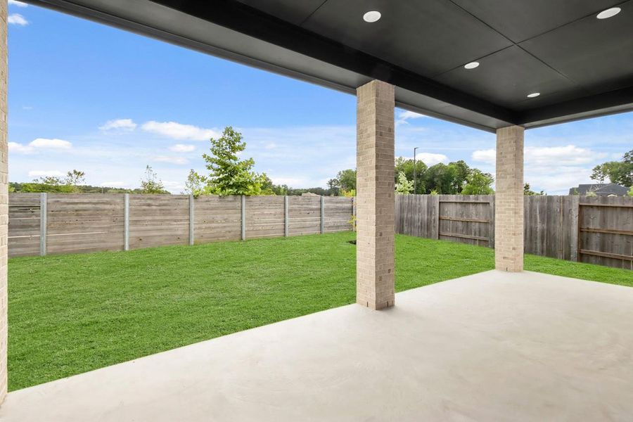 Exterior details and patio area of a home in ARTAVIA, Conroe (Image 20).