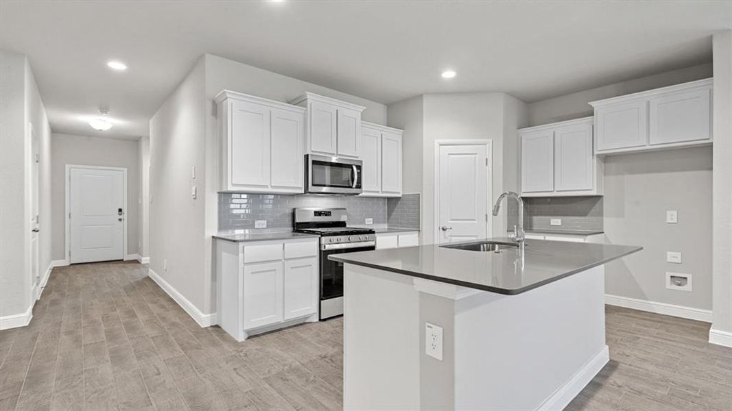 Kitchen - All Home and community information, including pricing, included features, terms, availability and amenities, are subject to change at any time without notice or obligation. All Drawings, pictures, photographs, video, square footages, floor plans, elevations, features, colors and sizes are approximate for illustration purposes only and will vary from the homes as built.