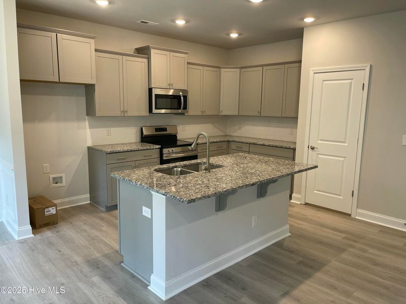 Furnished interior view inside a new home in Mill Creek Cove, Bolivia (Image 5).