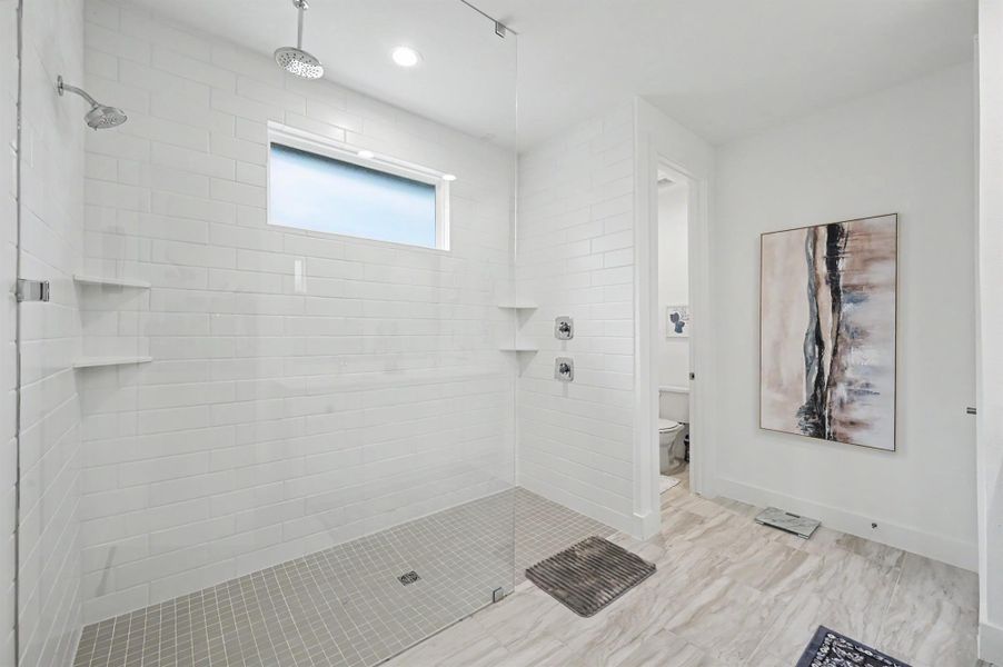 Walk-in Super shower with standard shower head AND rainfall shower head. Walk-in Super shower with standard shower head AND rainfall shower head.