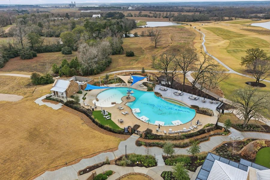 The community pool offers a peaceful place to unwind, surrounded by open green space and scenic views.