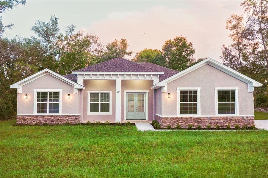 Front exterior of a new home in , Summerfield, FL, highlighting curb appeal (Image 2). Front exterior of a new home in , Summerfield, FL, highlighting curb appeal (Image 2).