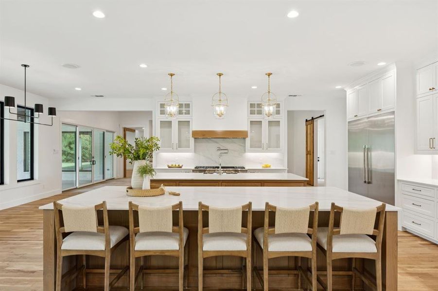 Chef's kitchen is a showstopper with dual oversized, white oak center islands - perfect for entertaining. Chef's kitchen is a showstopper with dual oversized, white oak center islands - perfect for entertaining.