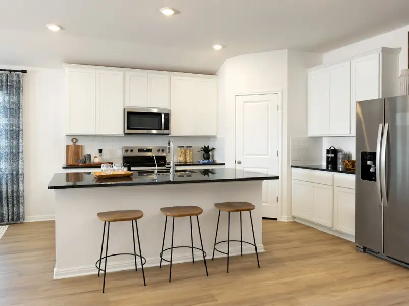 Furnished interior view inside a new home in Creekfall, Burnet (Image 3).