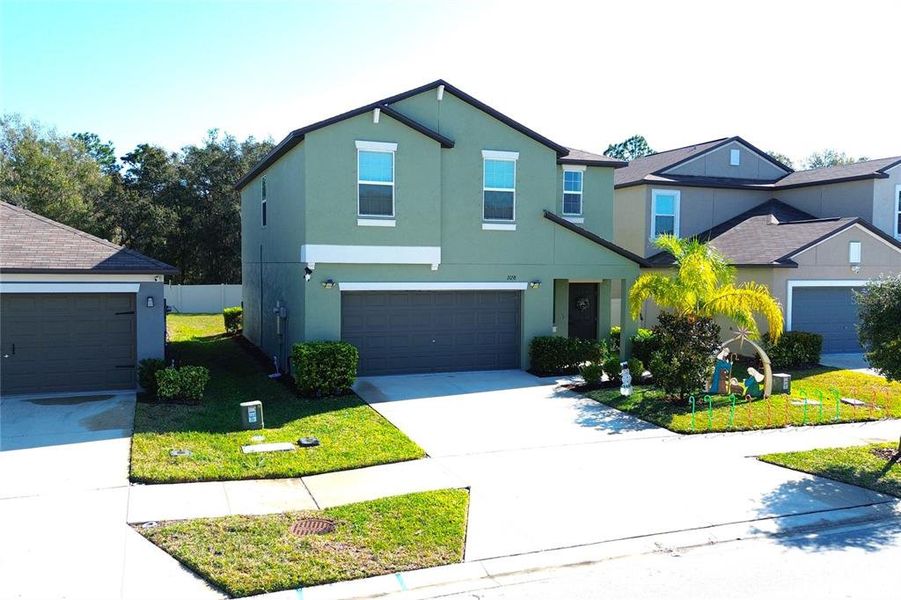 Front exterior of a new home in , Lutz, FL, highlighting curb appeal (Image 30). Front exterior of a new home in , Lutz, FL, highlighting curb appeal (Image 30).