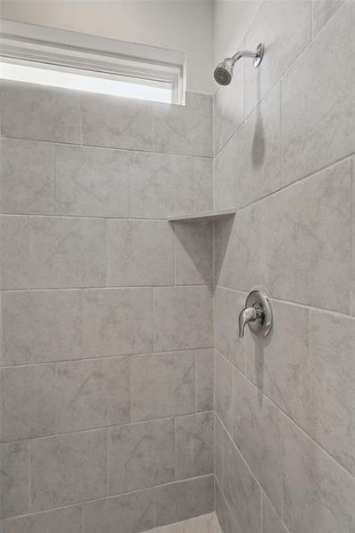 Bathroom with a tile shower Bathroom with a tile shower