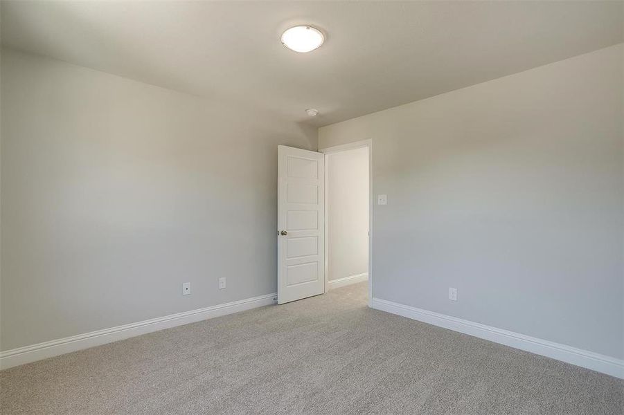 Unfurnished room featuring light carpet and baseboards Unfurnished room featuring light carpet and baseboards