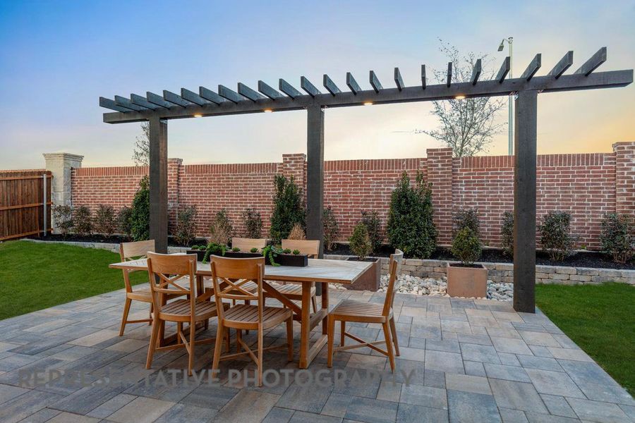 View of patio with outdoor dining space and a pergola View of patio with outdoor dining space and a pergola