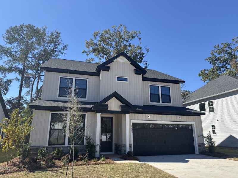 Front exterior of a new home in , North Charleston, SC, highlighting curb appeal (Image 2). Front exterior of a new home in , North Charleston, SC, highlighting curb appeal (Image 2).