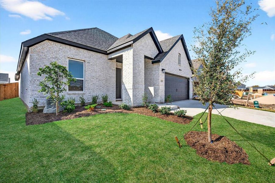 Front exterior of a new home in Hickory Hill, Sherman, TX, highlighting curb appeal (Image 1). Front exterior of a new home in Hickory Hill, Sherman, TX, highlighting curb appeal (Image 1).