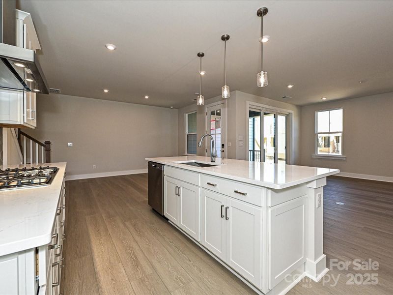 Large central island with loads of storage perfect for casual dining or meal preparation.