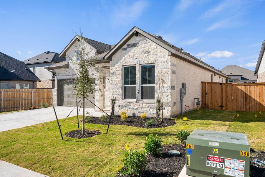 Front exterior of a new home in Heritage, Dripping Springs, TX, highlighting curb appeal (Image 20).