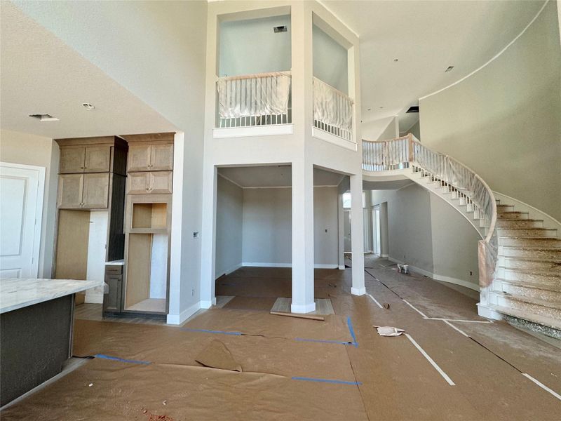 Formal Dining room with Curved Staircase