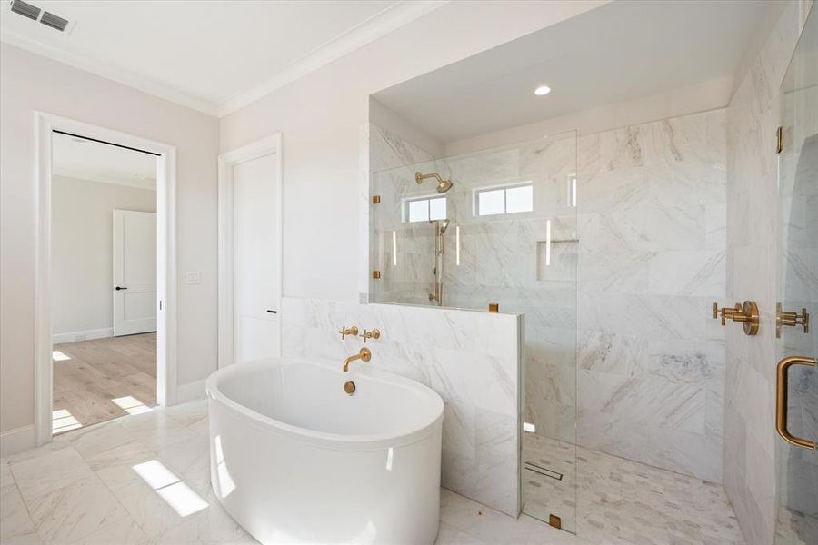 Luxury master bathroom with large soaking tub and shower