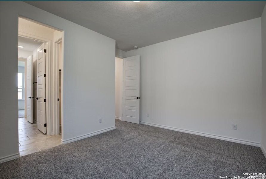 Spacious, unfurnished interior of a new home in The Reserve at Potranco Oaks, Castroville (Image 74).