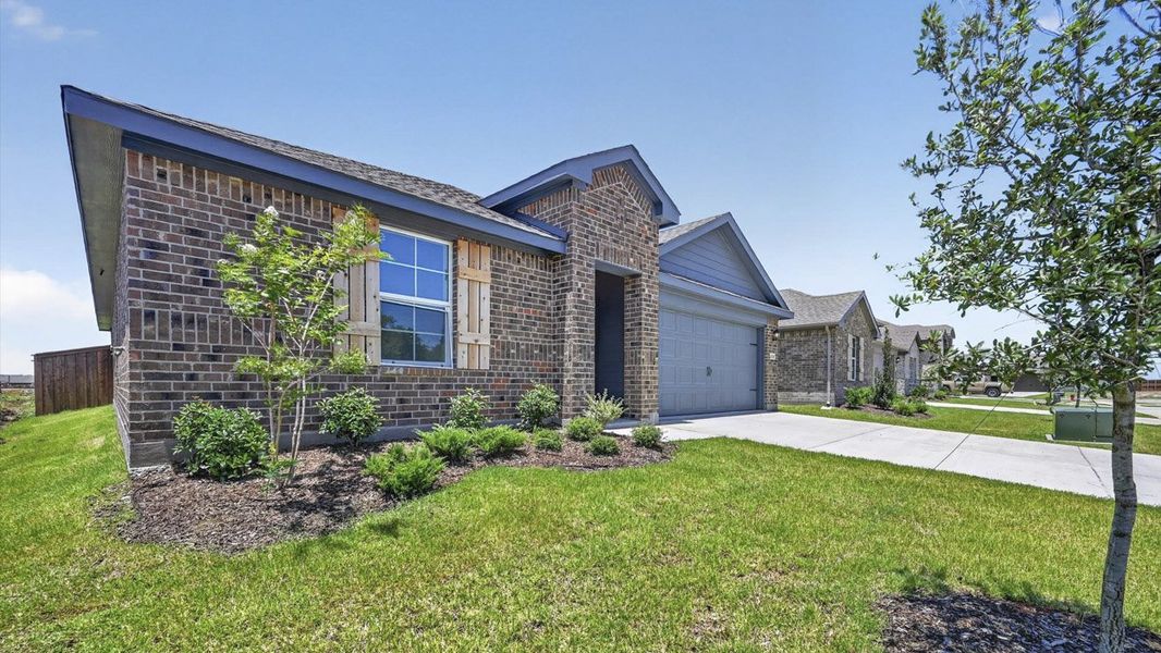 Front exterior of a new home in Sanger Circle, Sanger, TX, highlighting curb appeal (Image 2). Front exterior of a new home in Sanger Circle, Sanger, TX, highlighting curb appeal (Image 2).