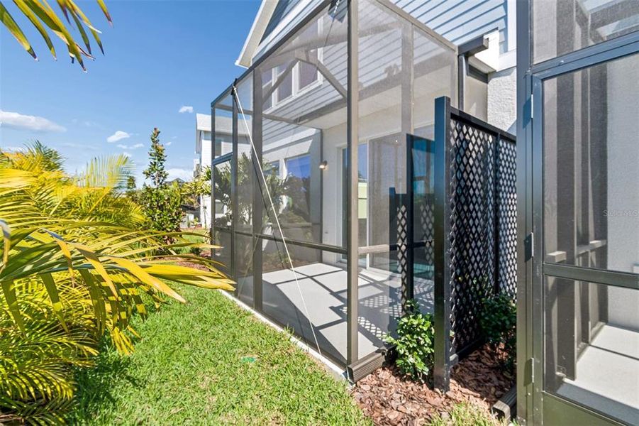 Exterior details and patio area of a home in North River Ranch – Townhomes, Parrish (Image 3).