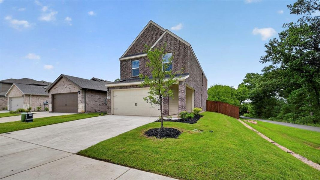 Front exterior of a new home in Hanolley Hills, Sherman, TX, highlighting curb appeal (Image 11). Front exterior of a new home in Hanolley Hills, Sherman, TX, highlighting curb appeal (Image 11).