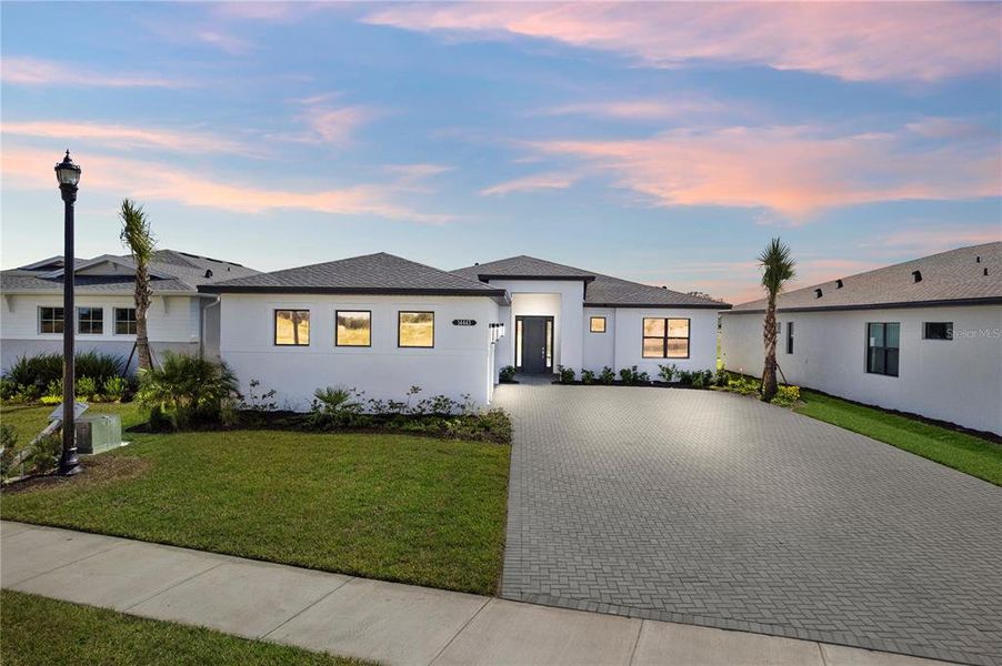Front exterior of a new home in Woodland Preserve, Parrish, FL, highlighting curb appeal (Image 20). Front exterior of a new home in Woodland Preserve, Parrish, FL, highlighting curb appeal (Image 20).