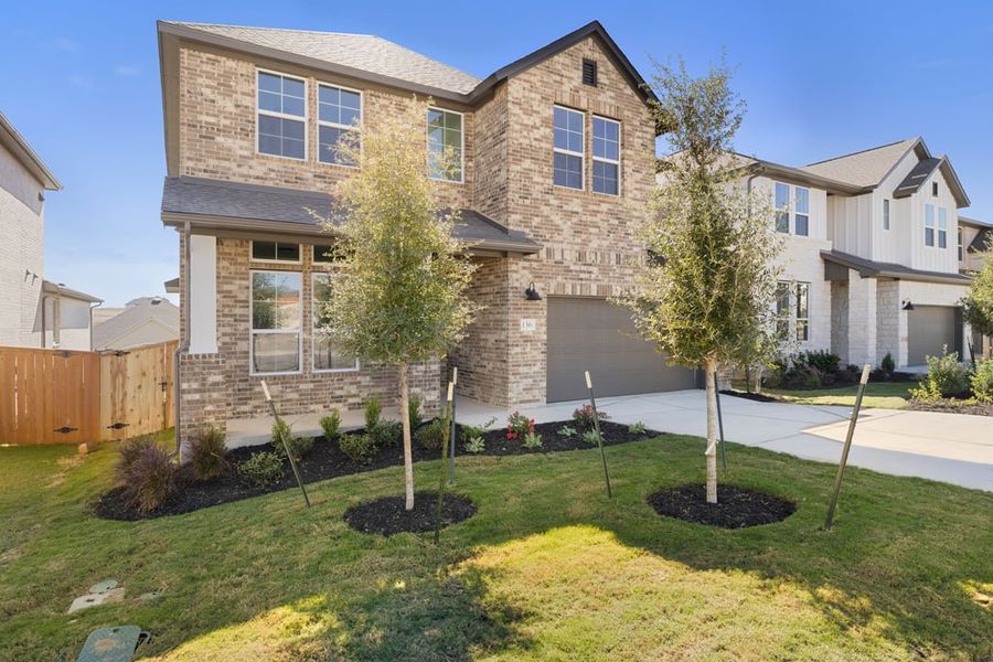 Front exterior of a new home in Park Collection at Lariat, Liberty Hill, TX, highlighting curb appeal (Image 2).