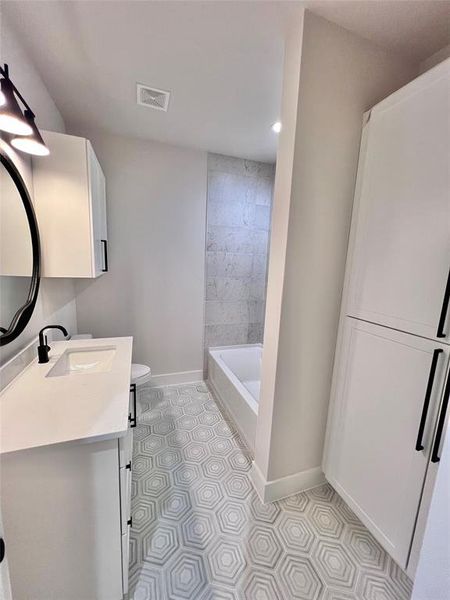 upstairs bath with large linen cabinet