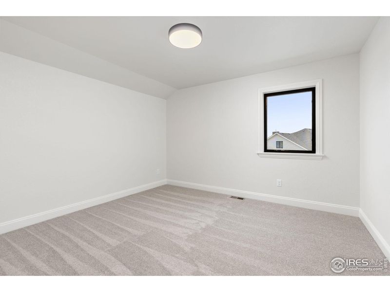 Spacious, unfurnished interior of a new home in Cottages at Kelly Farm, Greeley (Image 28).