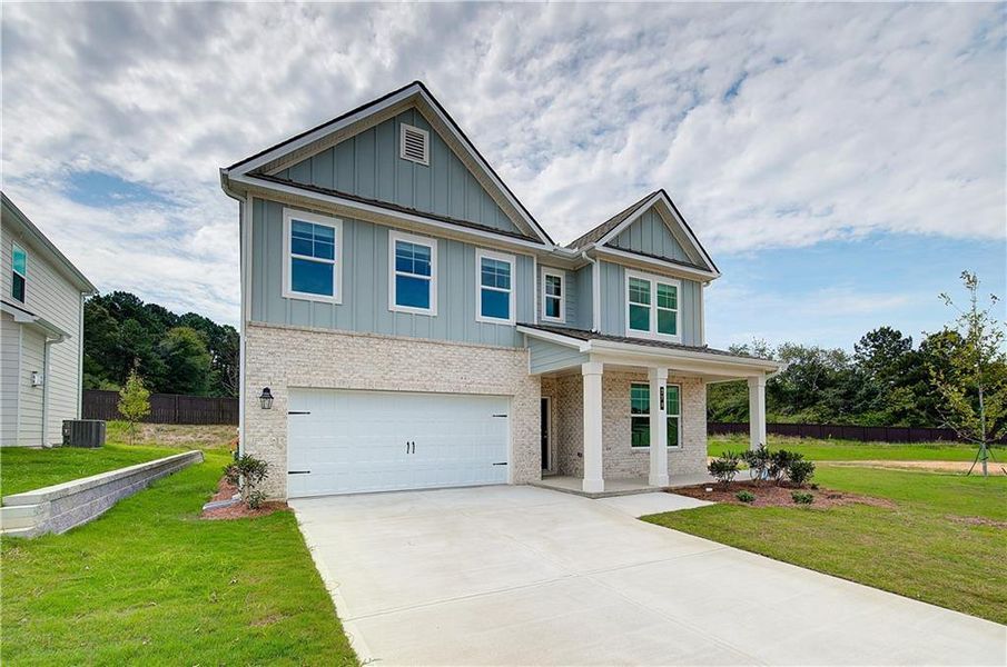 Front exterior of a new home in Abbotts Crossing, Conyers, GA, highlighting curb appeal (Image 14). Front exterior of a new home in Abbotts Crossing, Conyers, GA, highlighting curb appeal (Image 14).