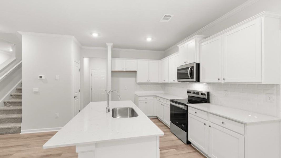 Furnished interior view inside a new home in Waypoint, Flowery Branch (Image 9).
