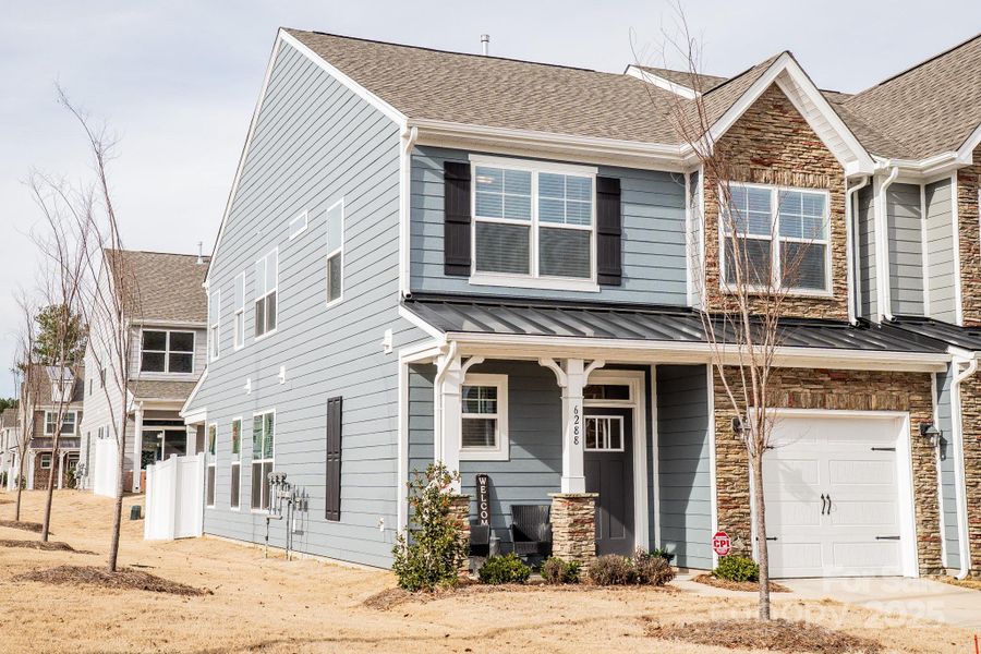 Front exterior of a new home in Harrisburg Village, Harrisburg, NC, highlighting curb appeal (Image 22).