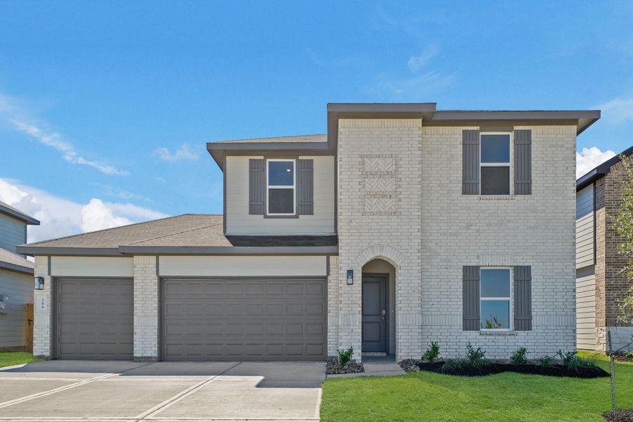 Front exterior of a new home in Medina, Dayton, TX, highlighting curb appeal (Image 22).