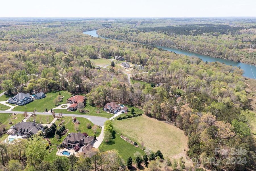 Aerial showing Catawba River in distance. Access from trails behind the property