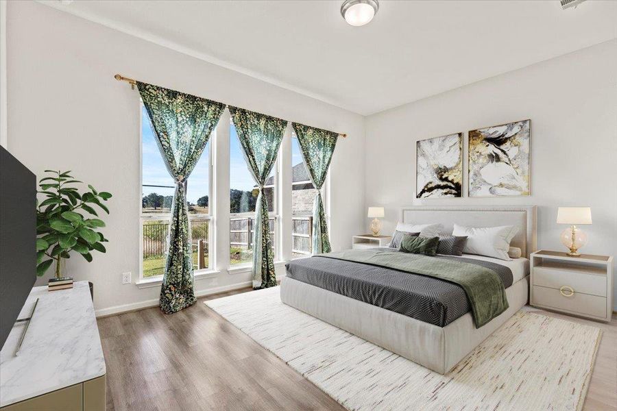 Bedroom featuring light wood-style flooring and baseboards. Virtual Staging Added. Bedroom featuring light wood-style flooring and baseboards. Virtual Staging Added.