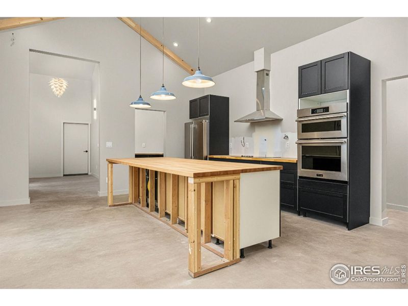 Kitchen layout includes all Frigidaire appliances: 36" induction cooktop, wall oven with microwave, french door refrigerator, and dishwasher Kitchen layout includes all Frigidaire appliances: 36" induction cooktop, wall oven with microwave, french door refrigerator, and dishwasher