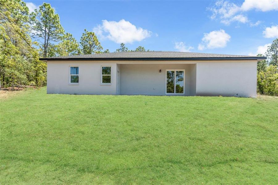 Exterior details and patio area of a home in , Citrus Springs (Image 3).
