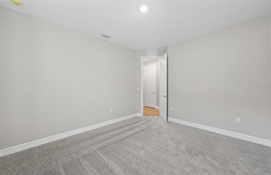 Spacious, unfurnished interior of a new home in The Strand at Cedar Grove, North Port (Image 19).