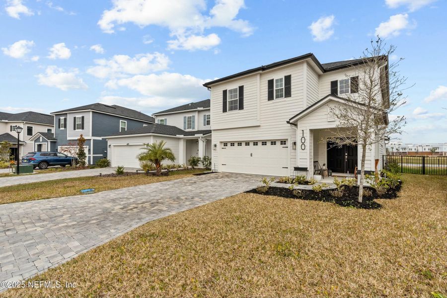 Front exterior of a new home in Silver Landing at SilverLeaf, St. Augustine, FL, highlighting curb appeal (Image 19).