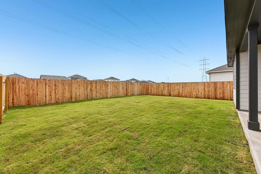 Exterior details and patio area of a home in Stallion Run, Buda (Image 4).