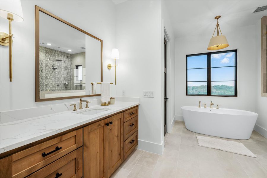 Bathroom with vanity, independent shower and bath, and tile patterned flooring