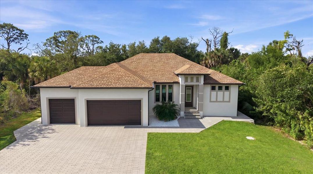 Front exterior of a new home in , Port Charlotte, FL, highlighting curb appeal (Image 25).