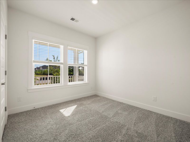 Spacious, unfurnished interior of a new home in The Coves at Lakes of Cane Bay, Summerville (Image 16).