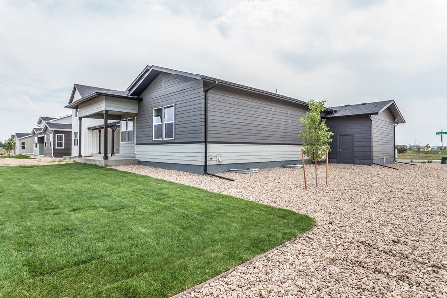Exterior details and patio area of a home in Prairie Song, Windsor (Image 32).
