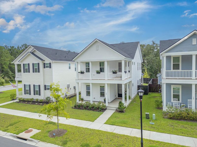 Front exterior of a new home in Limehouse Village: Row Collection, Summerville, SC, highlighting curb appeal (Image 28).