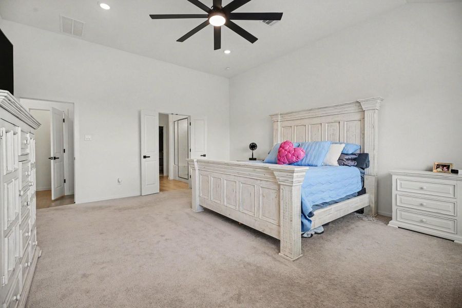 Primary bedroom offers ample space for a variety of furniture arrangements while maintaining a bright and open feel. Primary bedroom offers ample space for a variety of furniture arrangements while maintaining a bright and open feel.