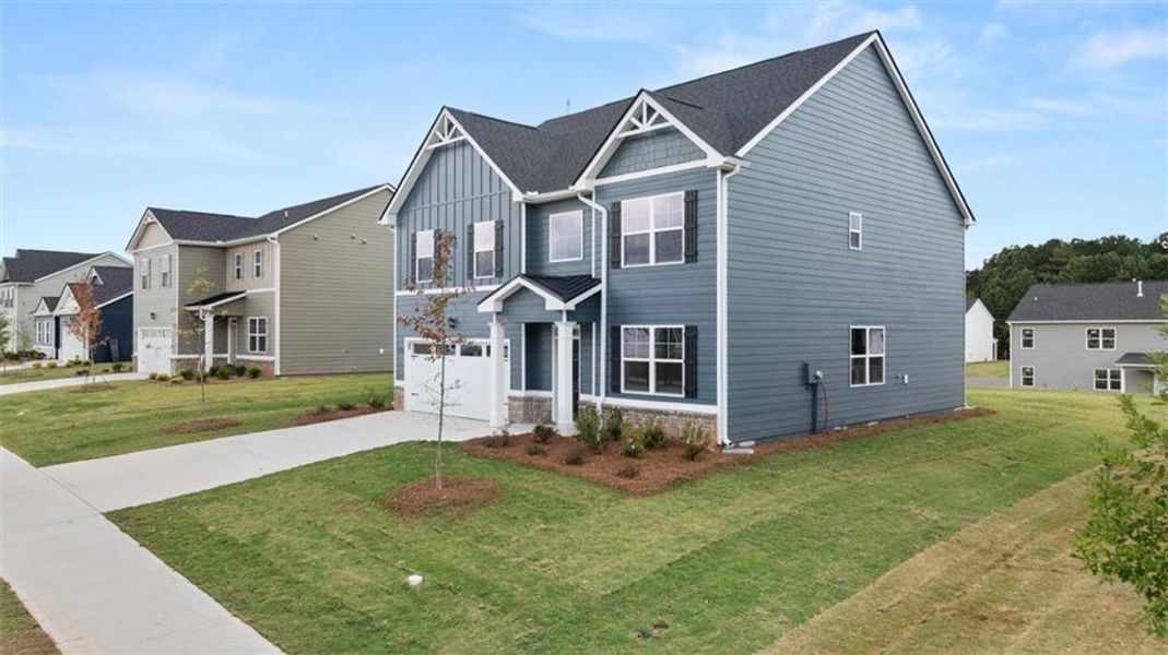 Front exterior of a new home in Preserve at Dove Creek, Winder, GA, highlighting curb appeal (Image 21).